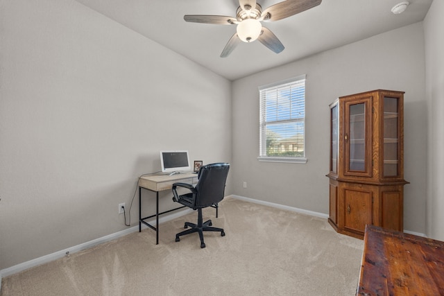 office space featuring a ceiling fan, carpet flooring, and baseboards