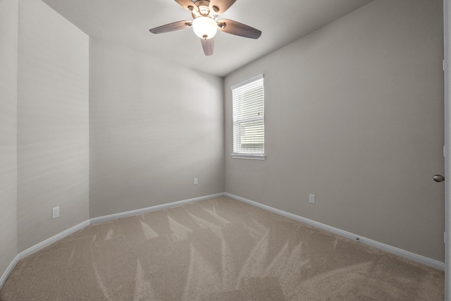 unfurnished room with light colored carpet, ceiling fan, and baseboards