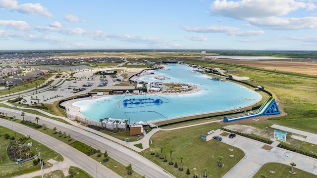 birds eye view of property with a water view