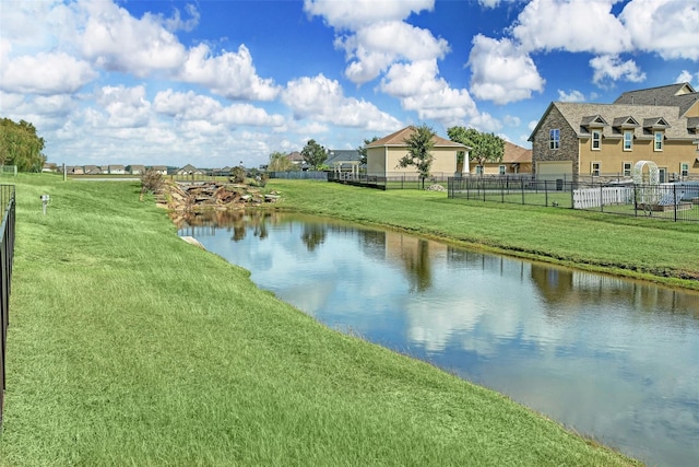 property view of water featuring fence