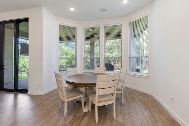 dining area featuring light wood-type flooring, visible vents, baseboards, and recessed lighting