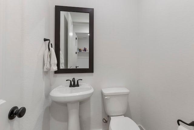 bathroom featuring toilet