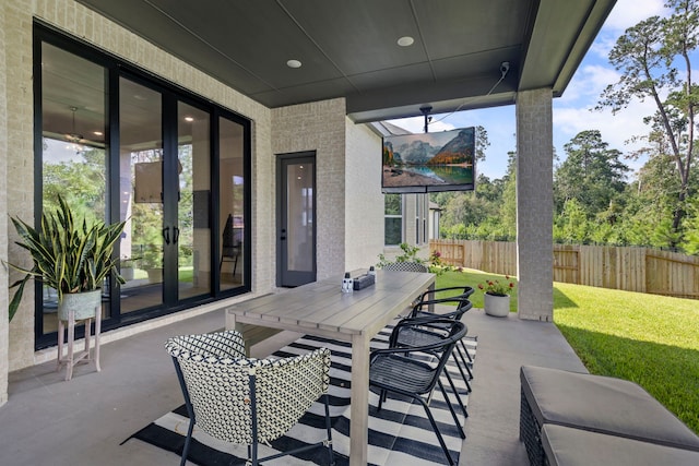 view of patio / terrace with outdoor dining space and fence