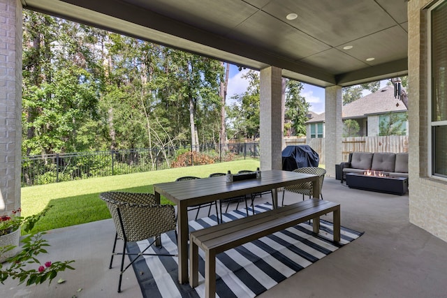 view of patio with outdoor dining space, a fenced backyard, an outdoor living space with a fire pit, and a grill