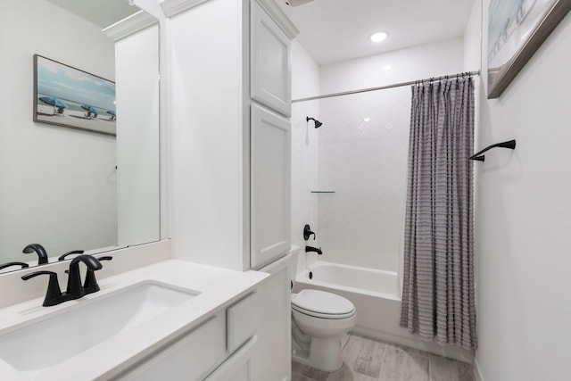 full bathroom featuring shower / tub combo, vanity, and toilet