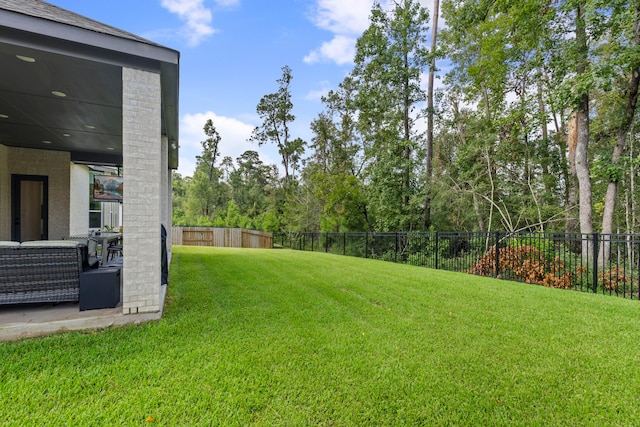 view of yard with a fenced backyard and a patio