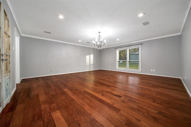 empty room with baseboards, dark wood-style flooring, visible vents, and a notable chandelier