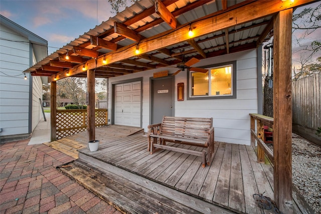 wooden terrace featuring fence