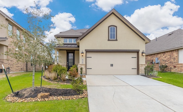 traditional-style house featuring metal roof, concrete driveway, stucco siding, a front lawn, and a standing seam roof