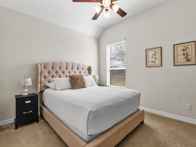 bedroom featuring light carpet, ceiling fan, baseboards, and lofted ceiling