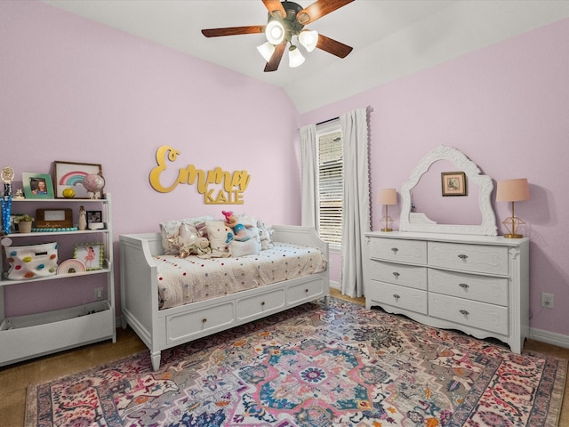 bedroom with lofted ceiling, ceiling fan, and baseboards