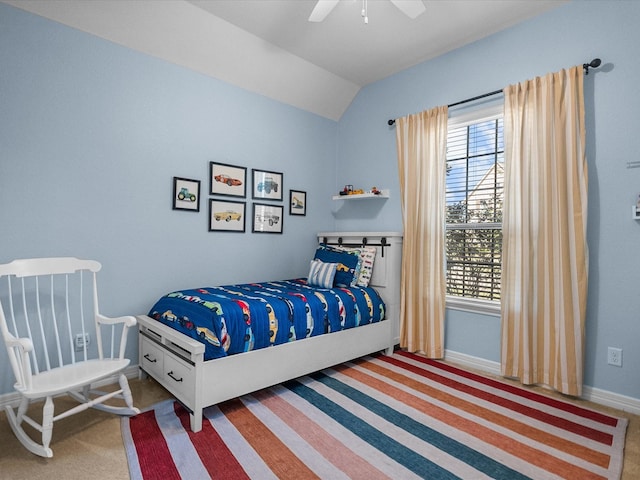 bedroom featuring vaulted ceiling, carpet floors, a ceiling fan, and baseboards