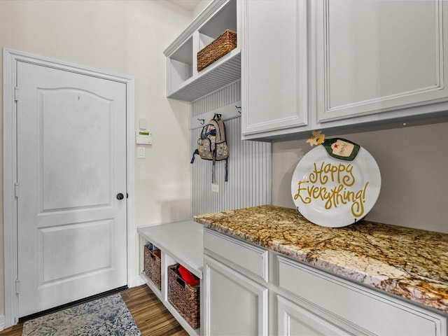 mudroom with dark wood-style floors