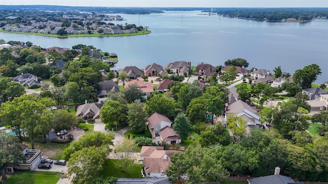 birds eye view of property with a residential view and a water view