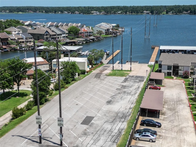 aerial view with a residential view and a water view