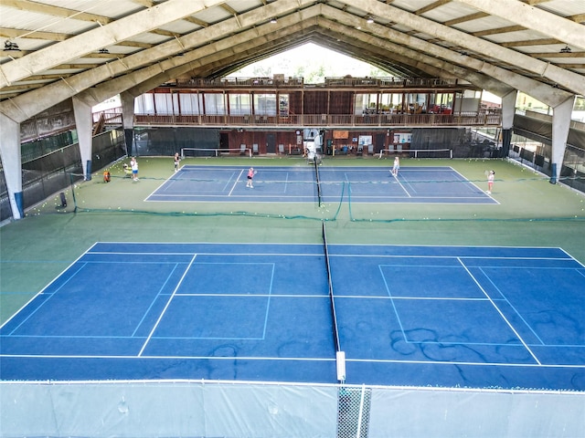 view of sport court featuring fence