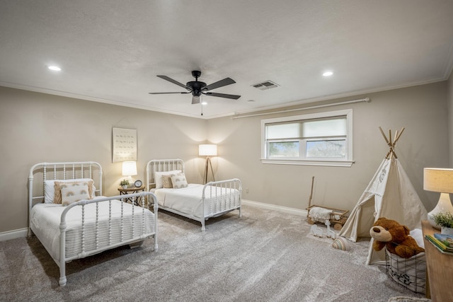 bedroom with baseboards, carpet floors, visible vents, and crown molding