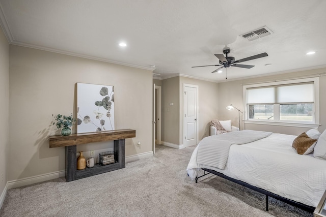 carpeted bedroom with ornamental molding, visible vents, and baseboards