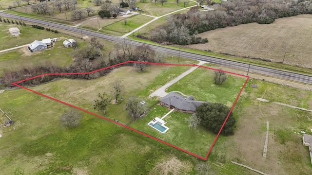 birds eye view of property featuring a rural view