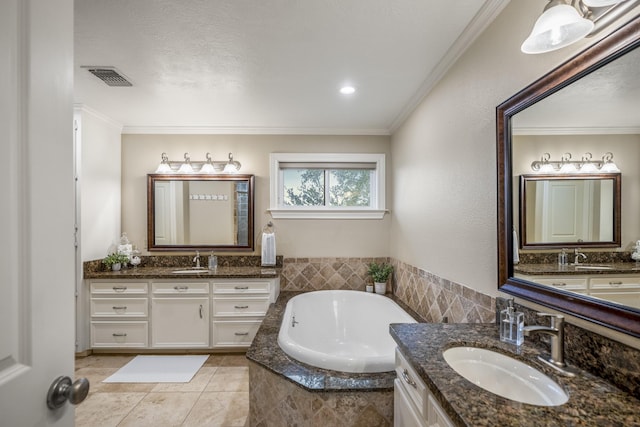 full bathroom featuring ornamental molding, a sink, and visible vents