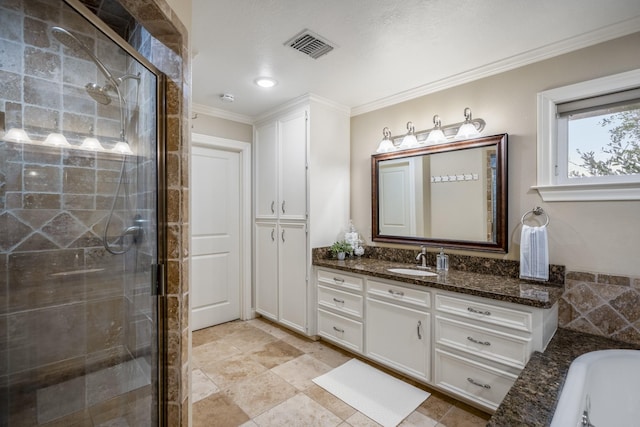 full bathroom featuring a tub to relax in, visible vents, vanity, ornamental molding, and a stall shower