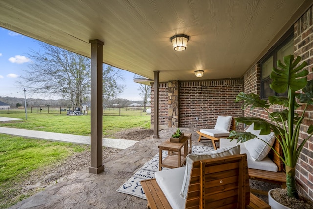 view of patio with outdoor lounge area and fence