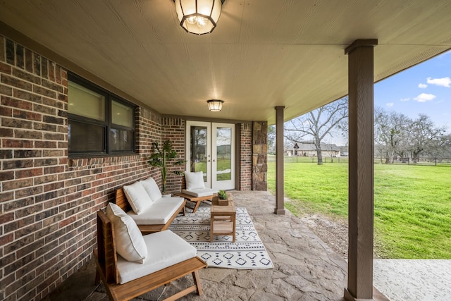 view of patio with fence, an outdoor hangout area, and french doors