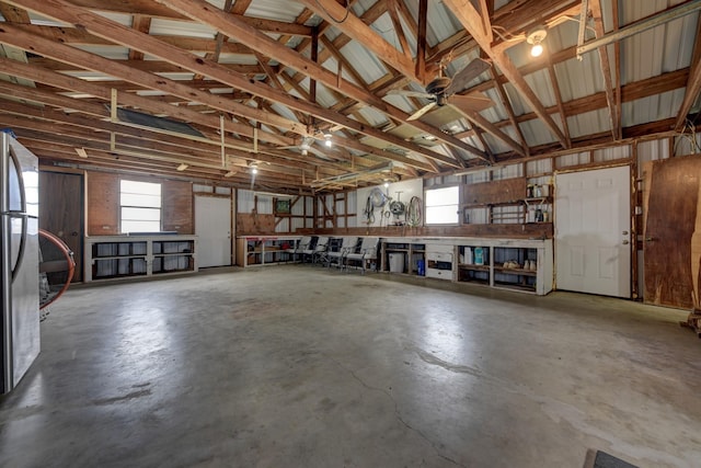 garage with freestanding refrigerator
