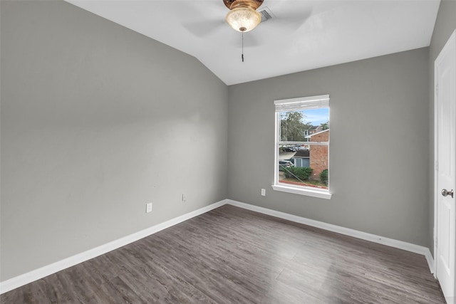 unfurnished room featuring dark wood-style floors, ceiling fan, and baseboards