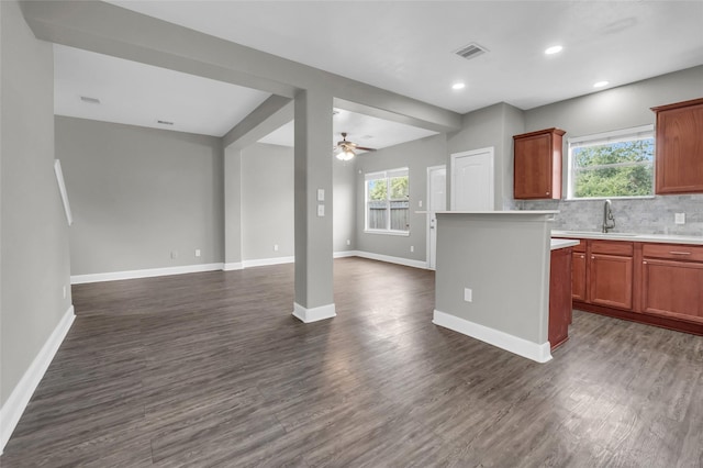 kitchen featuring open floor plan, light countertops, dark wood finished floors, and visible vents