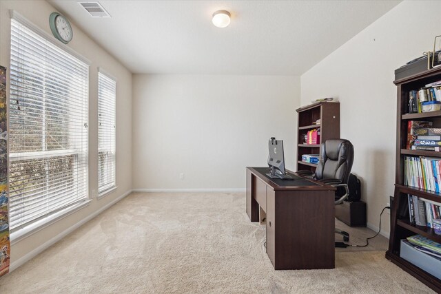 14510 Myers Dr, Houston, TX 77090 - office featuring baseboards, light carpet, and visible vents