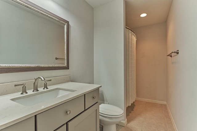 full bathroom featuring toilet, recessed lighting, vanity, baseboards, and tile patterned floors