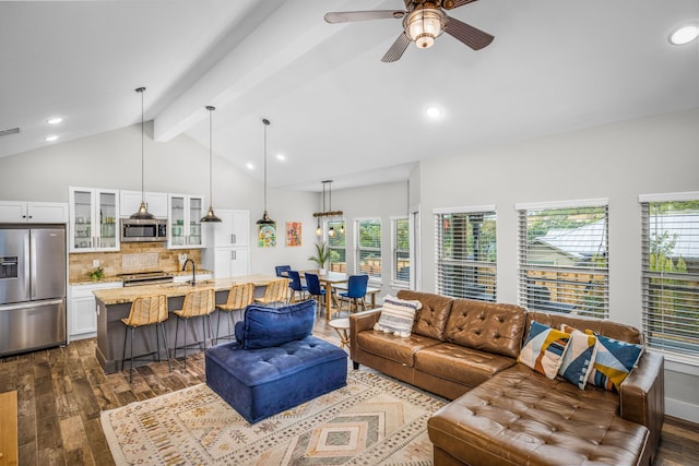 living area featuring visible vents, vaulted ceiling with beams, dark wood finished floors, recessed lighting, and a ceiling fan