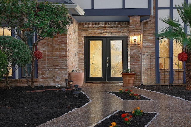 doorway to property with brick siding