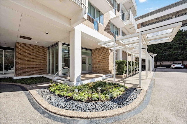 exterior space featuring brick siding