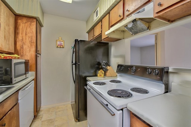 kitchen with light countertops, white appliances, brown cabinets, and under cabinet range hood