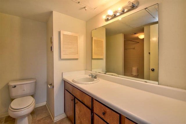 full bath with baseboards, a shower, toilet, tile patterned floors, and vanity