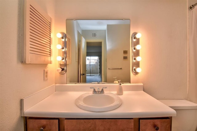 bathroom featuring visible vents and vanity