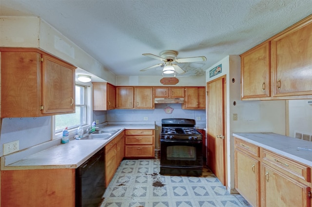 kitchen with light floors, light countertops, a sink, under cabinet range hood, and black appliances