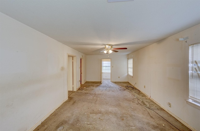 unfurnished room featuring a ceiling fan