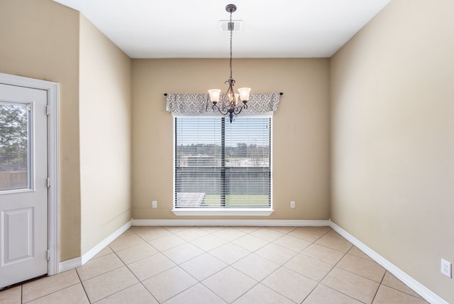 unfurnished dining area featuring light tile patterned floors, visible vents, baseboards, and an inviting chandelier