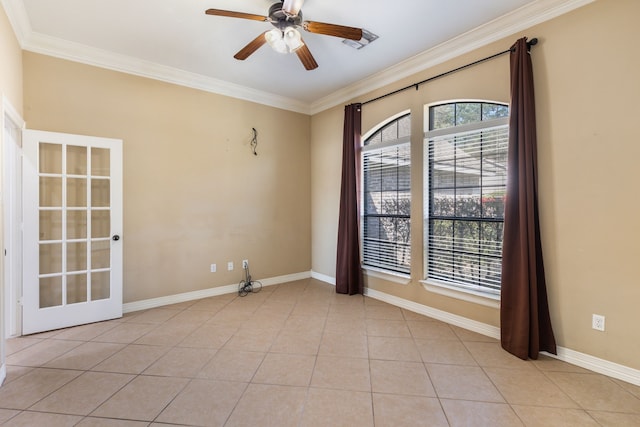 unfurnished room featuring a healthy amount of sunlight, light tile patterned flooring, a ceiling fan, and ornamental molding