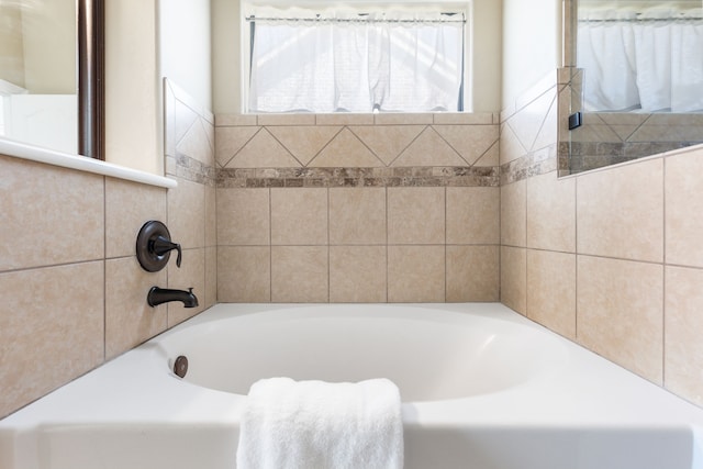 bathroom featuring a bath