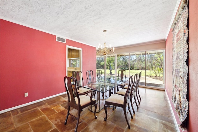 dining space featuring an inviting chandelier, baseboards, visible vents, and ornamental molding