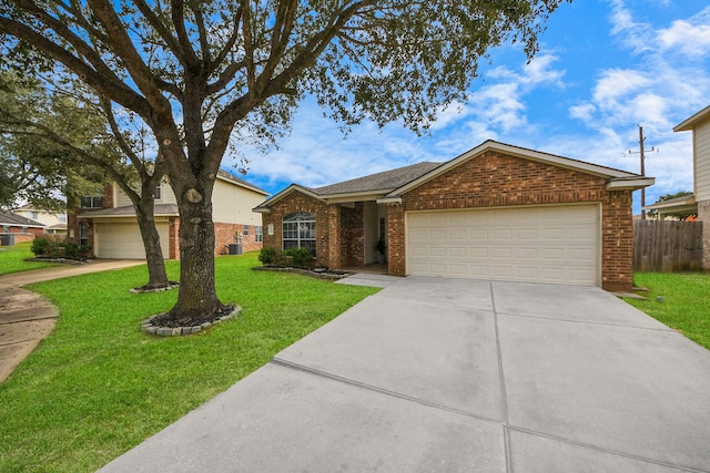 single story home featuring a front yard, concrete driveway, brick siding, and an attached garage