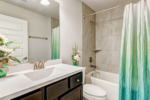 bathroom featuring toilet, shower / bath combo, and vanity