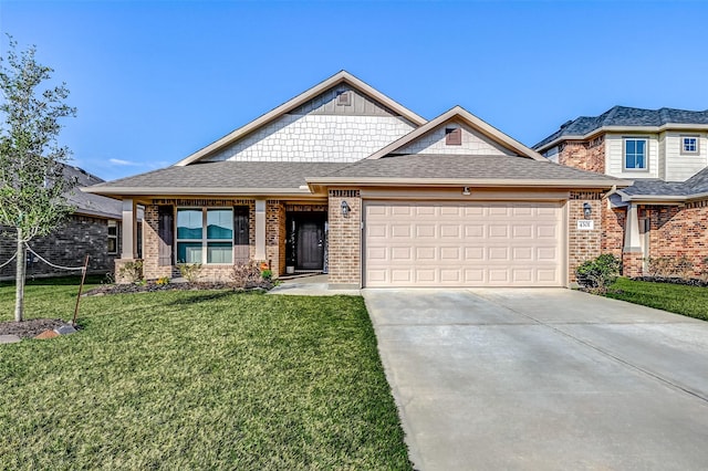 view of front of property featuring driveway, a front lawn, an attached garage, and brick siding