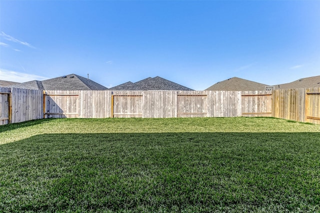 view of yard featuring a fenced backyard