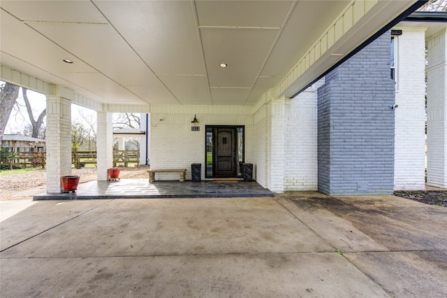 property entrance with brick siding