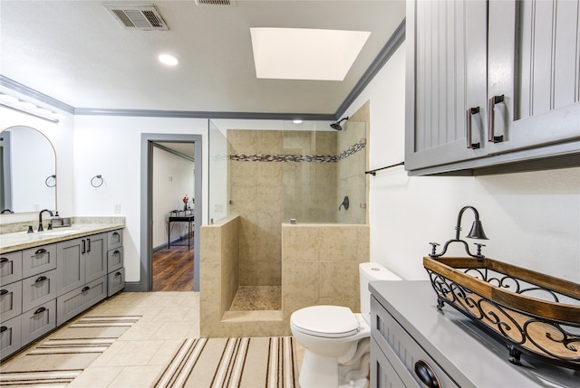 bathroom with ornamental molding, visible vents, and walk in shower